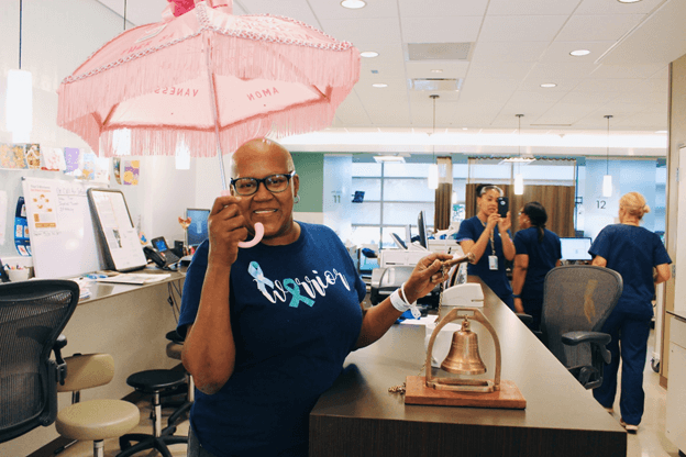 Jacqueline holding a pink umbrella